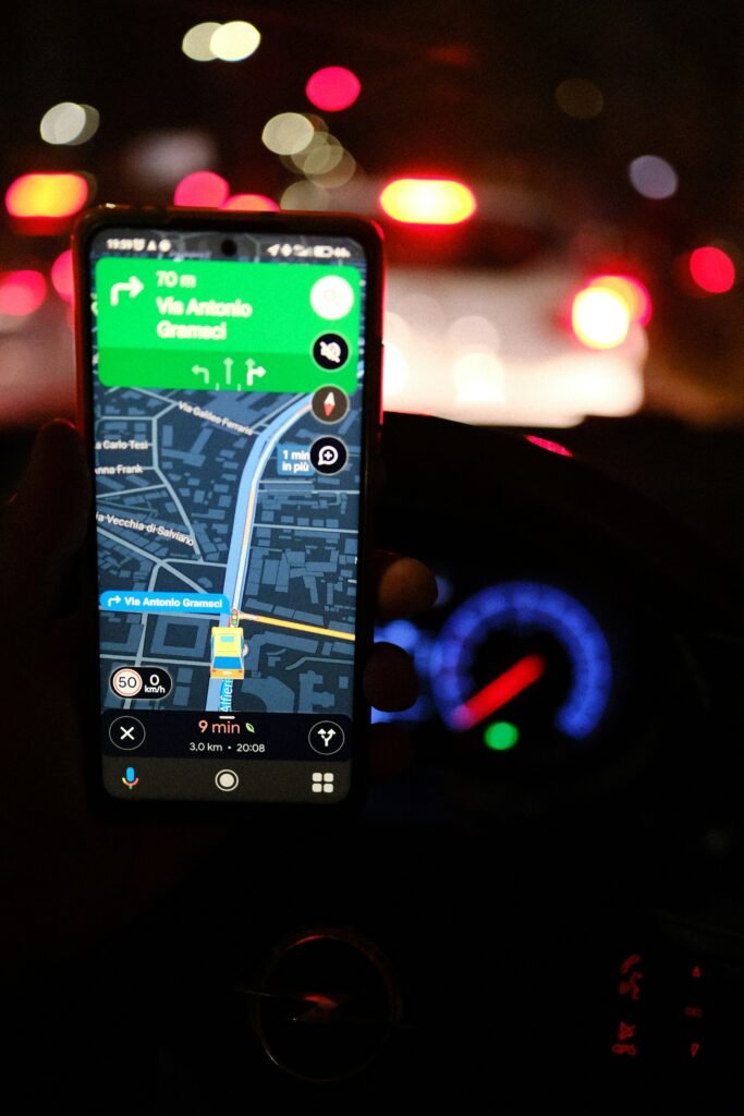 Smartphone showing a navigation map at night.